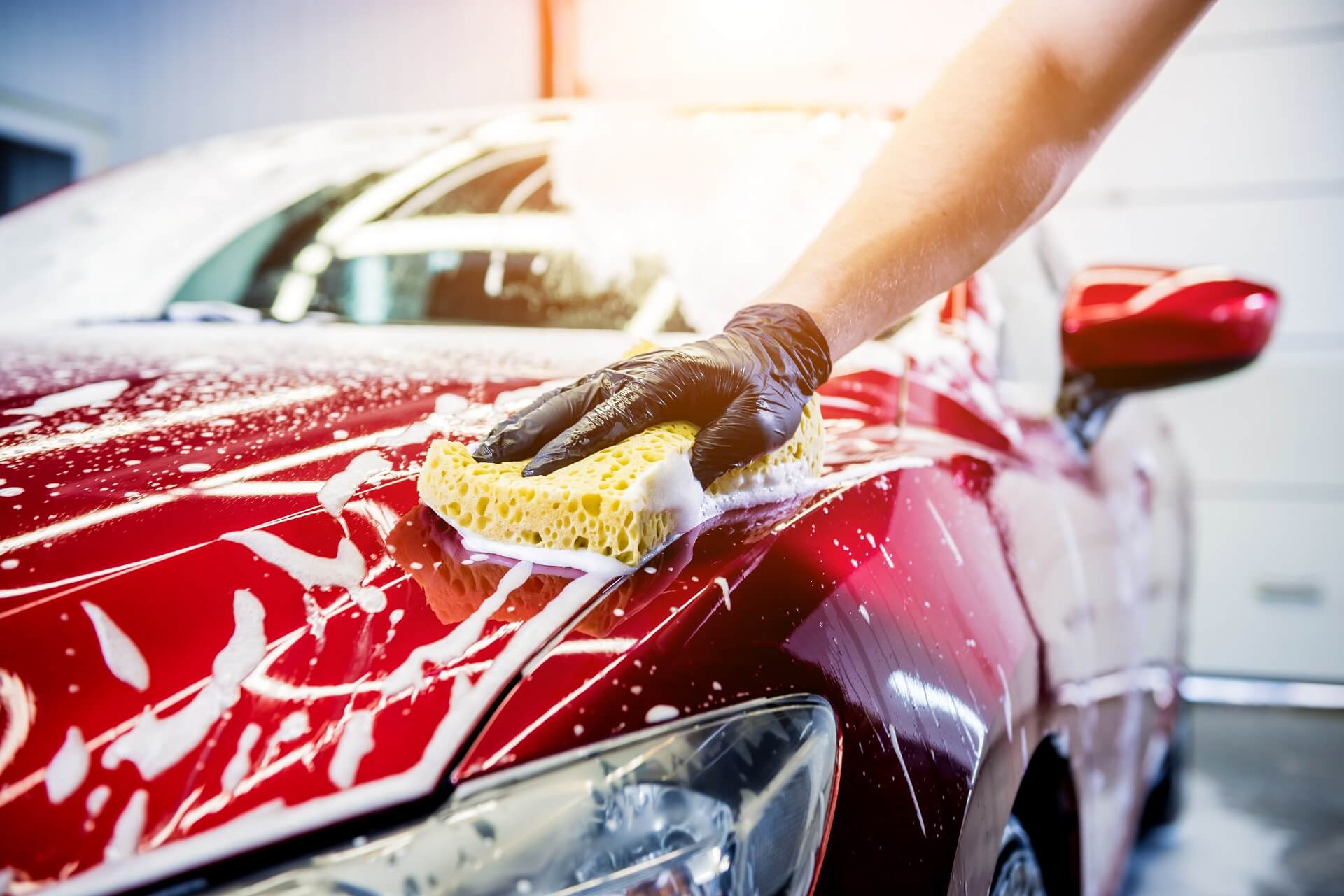 3—-worker-washing-red-car-with-sponge-car-wash (1) 3----worker-washing-red-car-with-sponge-car-wash (1)